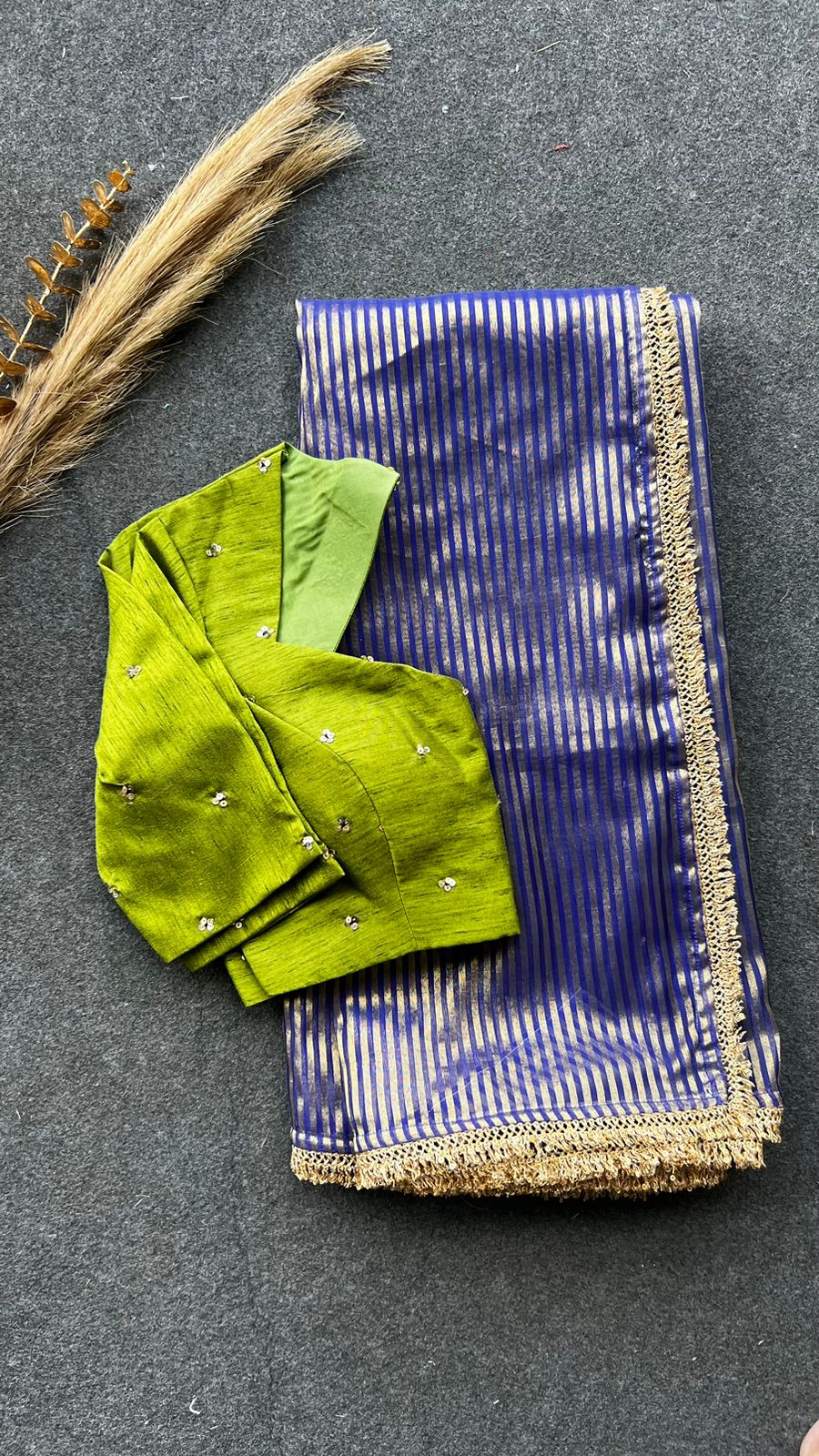 Blue stripped tissue saree with green hand worked blouse