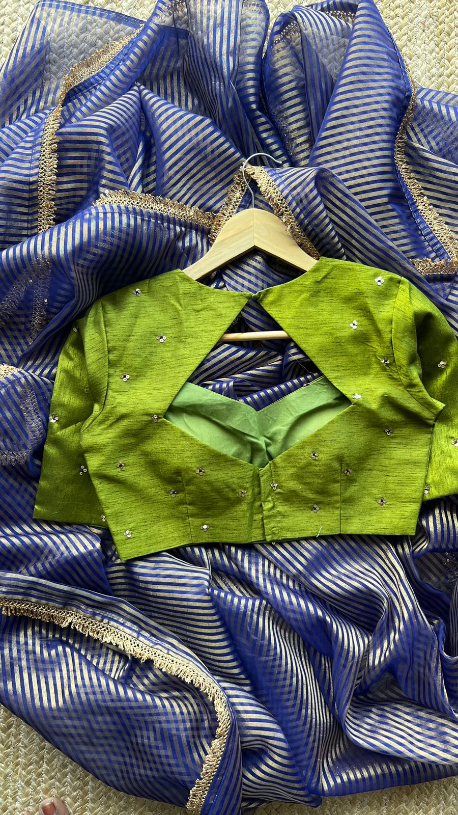 Blue stripped tissue saree with green hand worked blouse