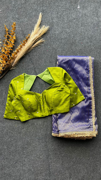 Blue stripped tissue saree with green hand worked blouse