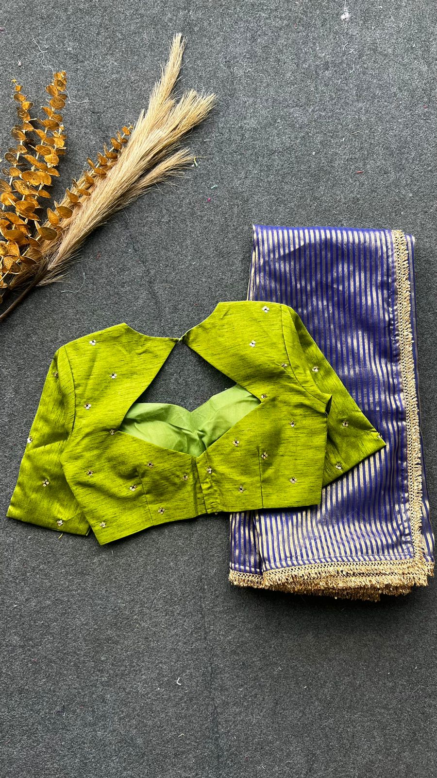 Blue stripped tissue saree with green hand worked blouse