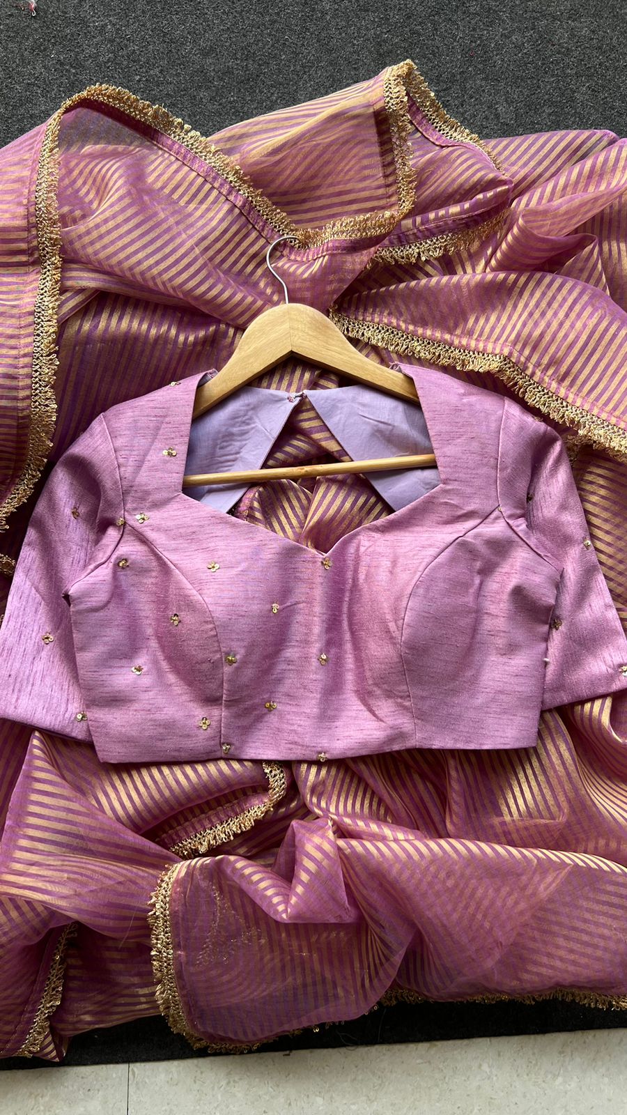 Onion pink stripped tissue saree with hand worked blouse