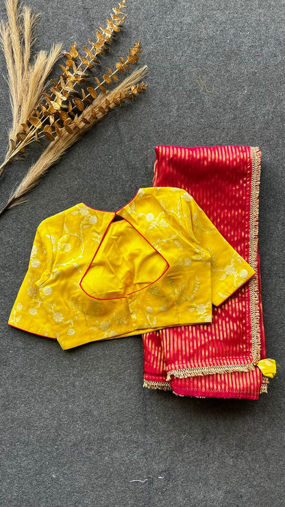 Red stripped tissue saree with yellow silk banarasi blouse