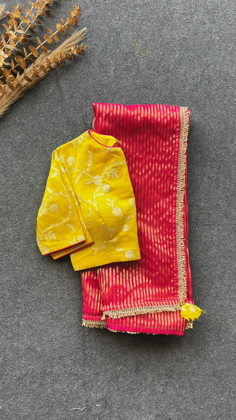 Red stripped tissue saree with yellow silk banarasi blouse