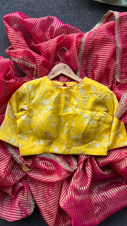 Red stripped tissue saree with yellow silk banarasi blouse