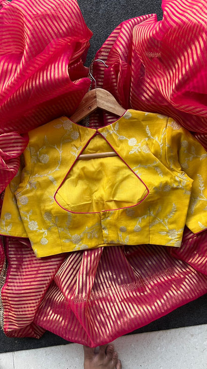 Red stripped tissue saree with yellow silk banarasi blouse