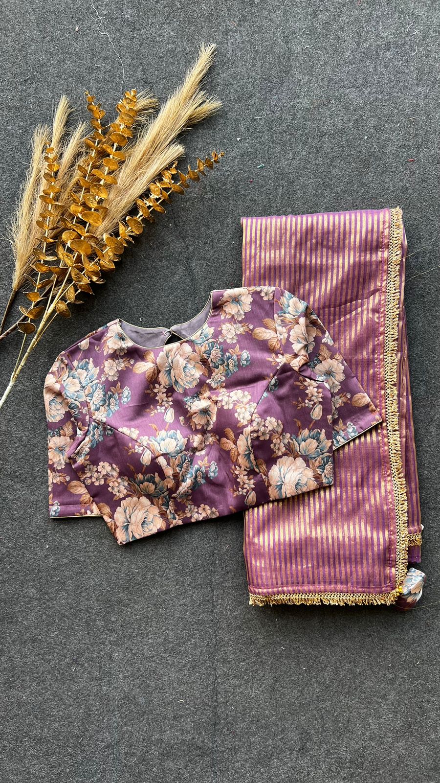 Wine stripped tissue saree with wine silk floral blouse