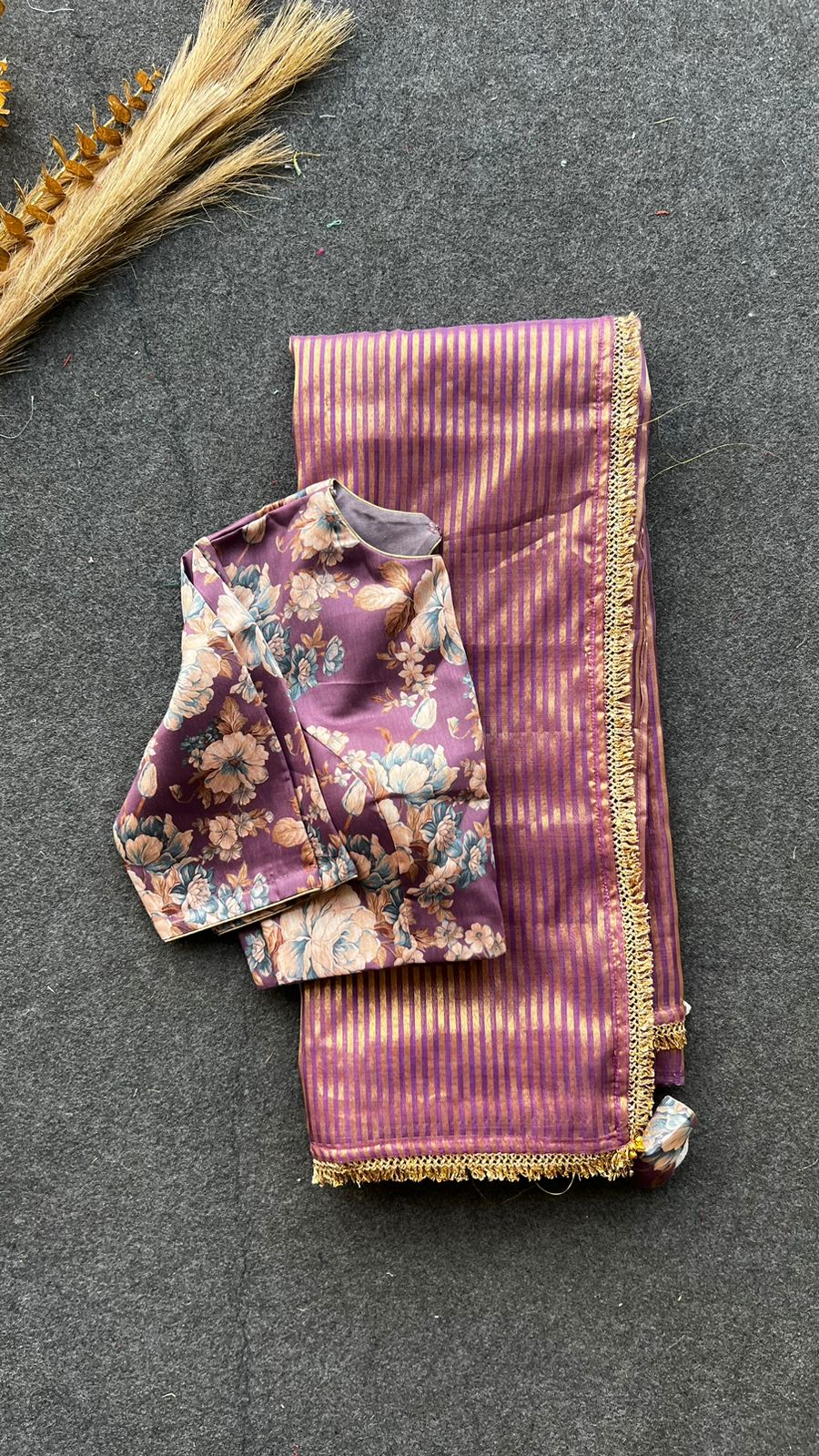 Wine stripped tissue saree with wine silk floral blouse