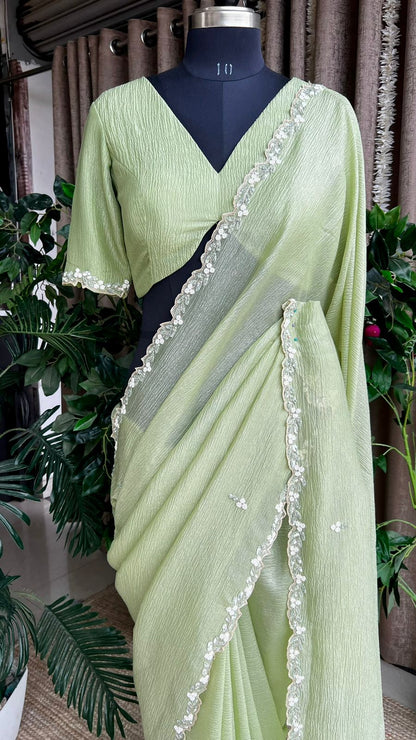 Green crushed tissue saree with hand worked blouse