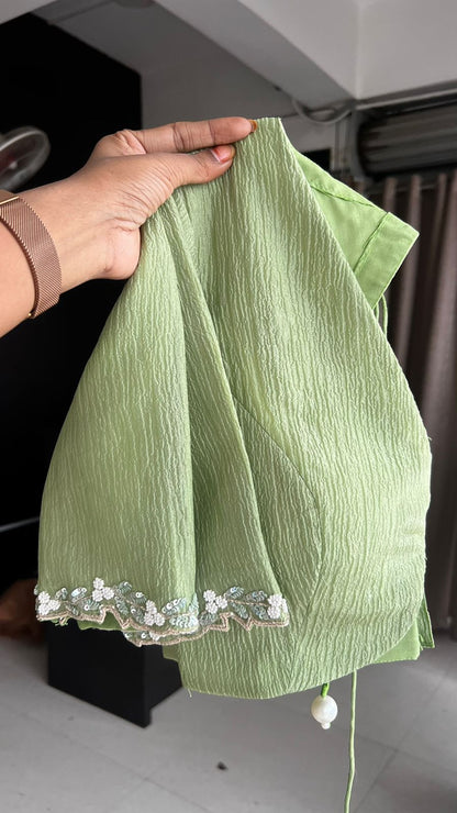 Green crushed tissue saree with hand worked blouse