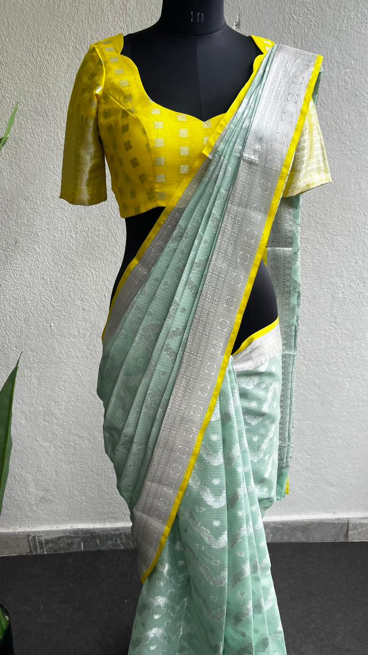 Sea green kota silk saree with yellow blouse