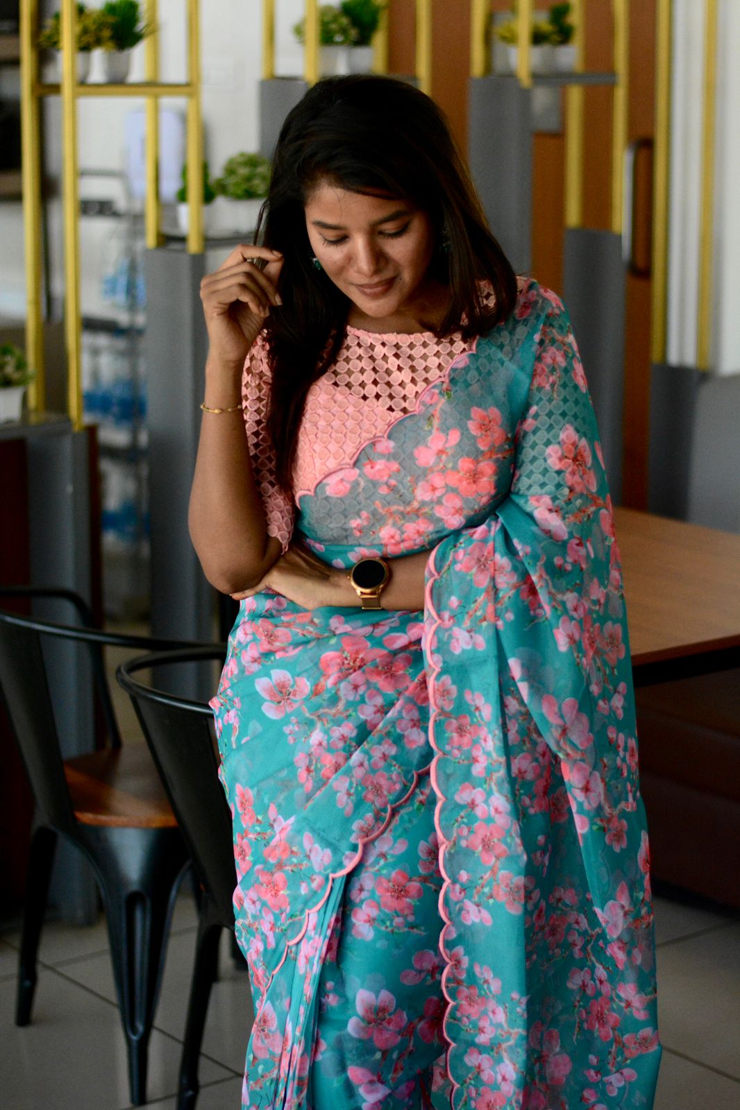 Blue floral organza saree with pink crochet blouse