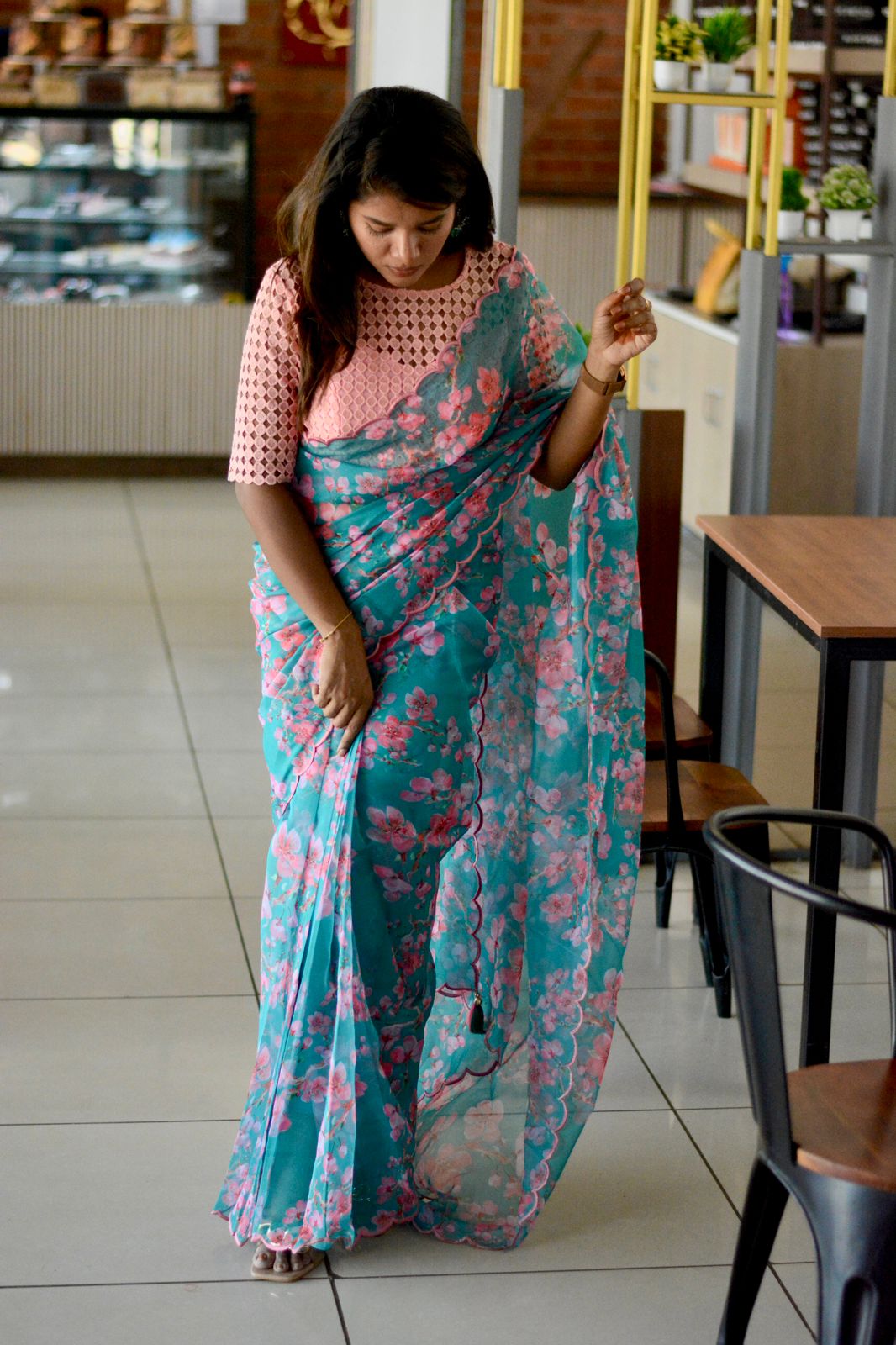 Blue floral organza saree with pink crochet blouse