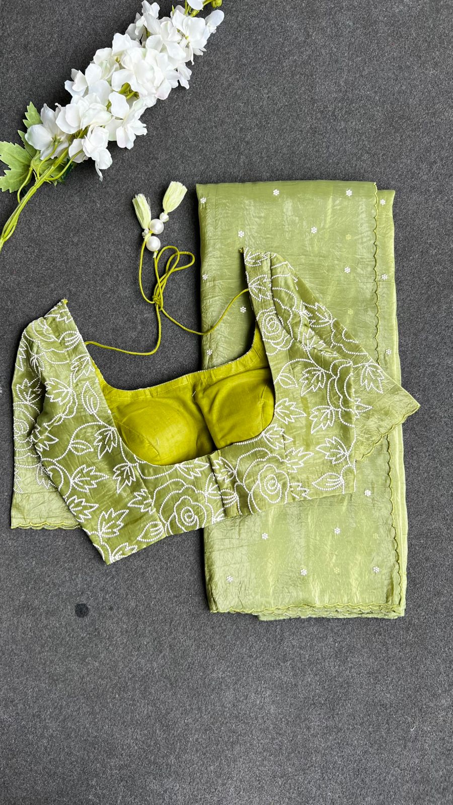 Green silk tissue saree with embroidered blouse