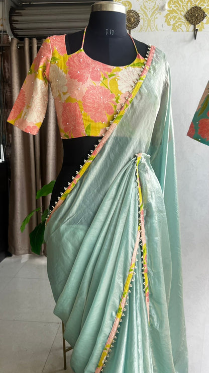 Sea blue glass tissue saree with floral hand work blouse