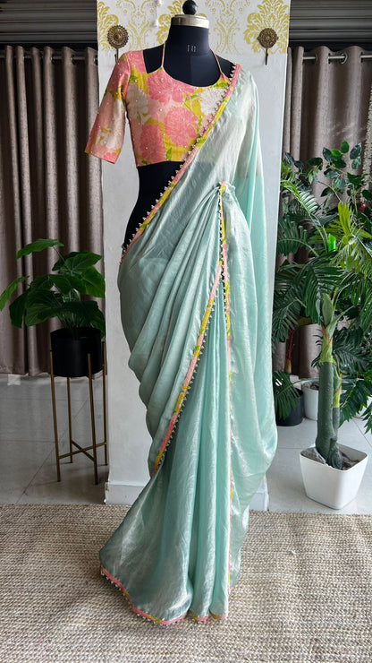 Sea blue glass tissue saree with floral hand work blouse