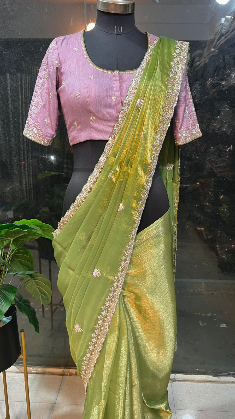 Green tissue saree with lavender embroidered blouse