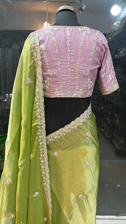 Green tissue saree with lavender embroidered blouse