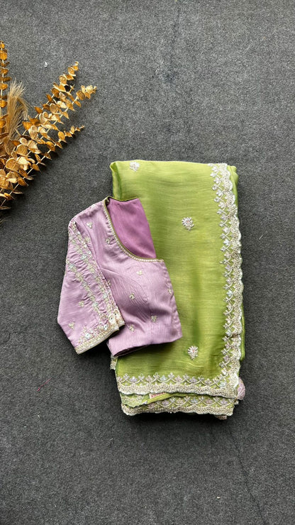 Green tissue saree with lavender embroidered blouse