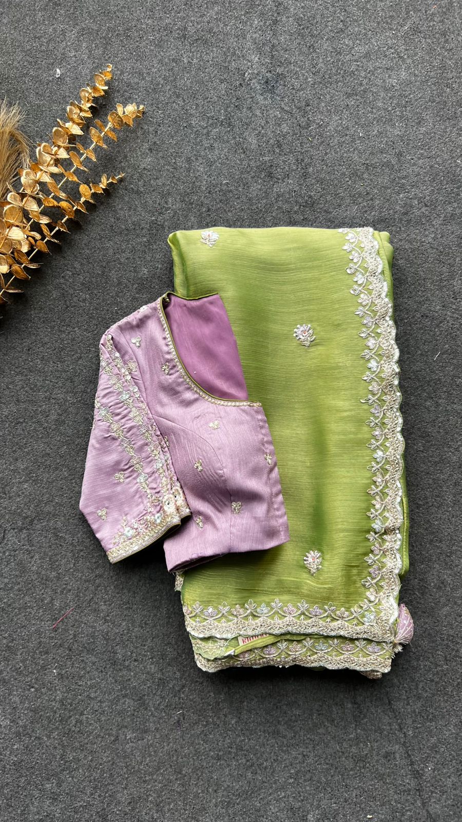 Green tissue saree with lavender embroidered blouse