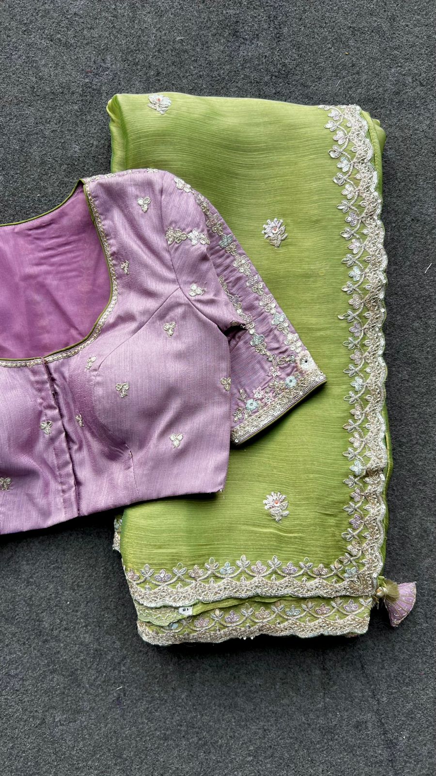 Green tissue saree with lavender embroidered blouse