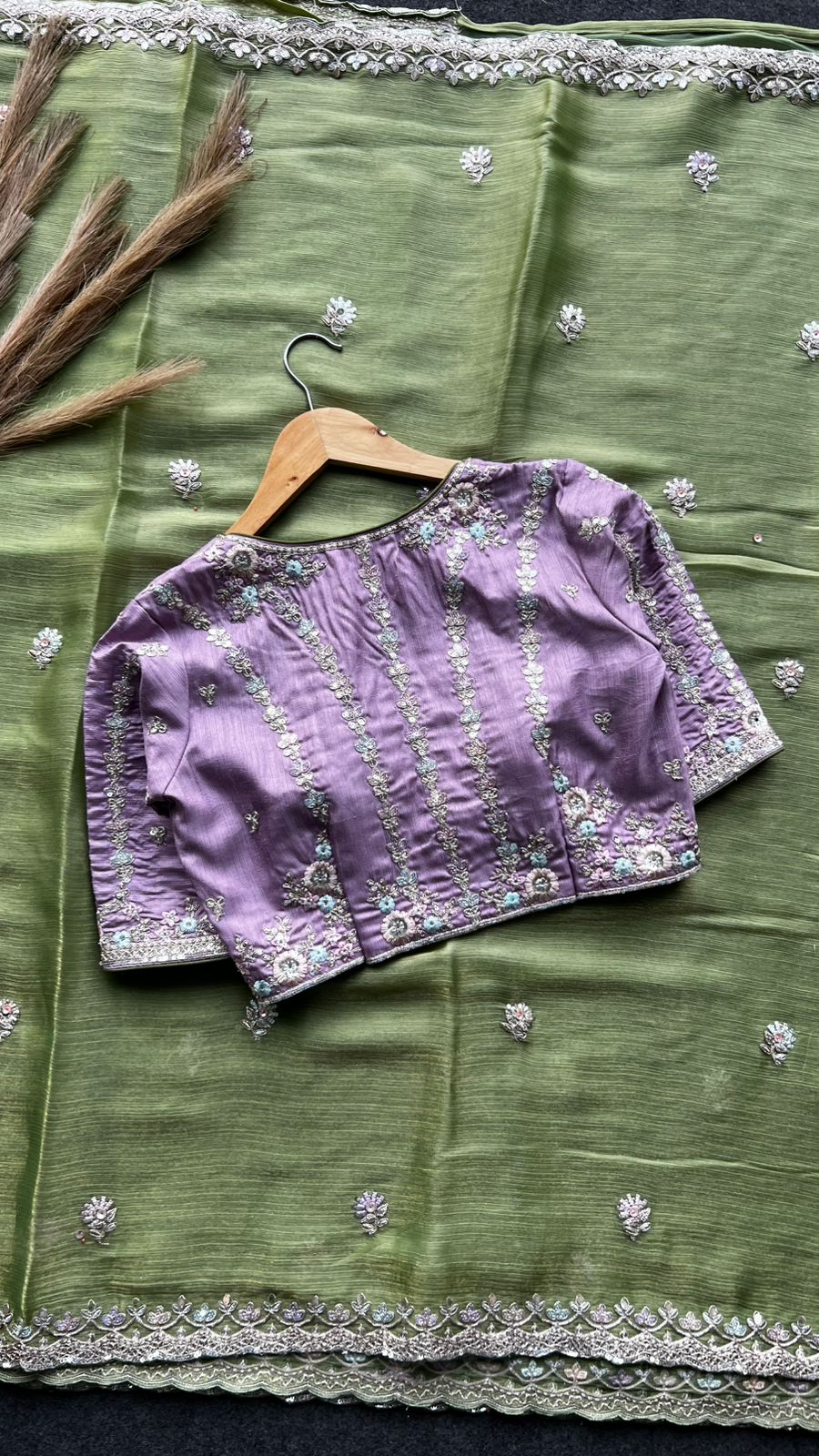 Green tissue saree with lavender embroidered blouse