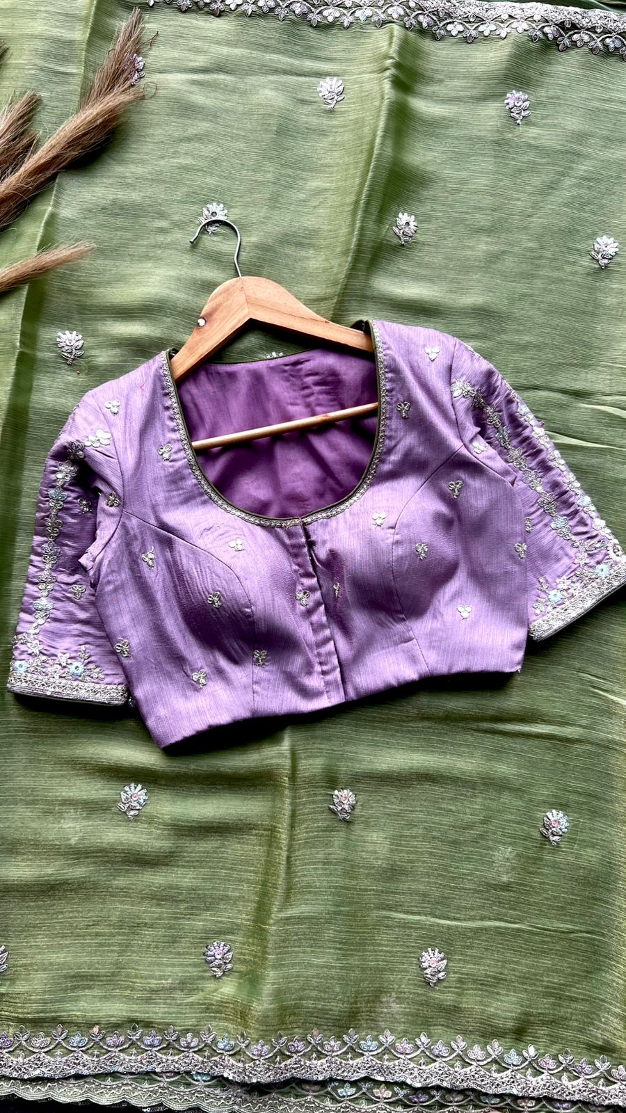 Green tissue saree with lavender embroidered blouse