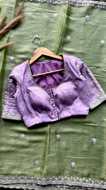 Green tissue saree with lavender embroidered blouse