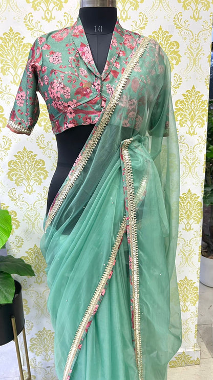 Cyan blue organza saree with floral collar blouse