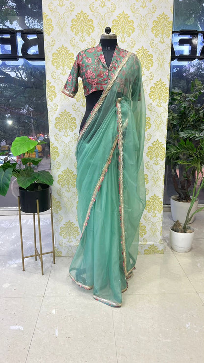 Cyan blue organza saree with floral collar blouse