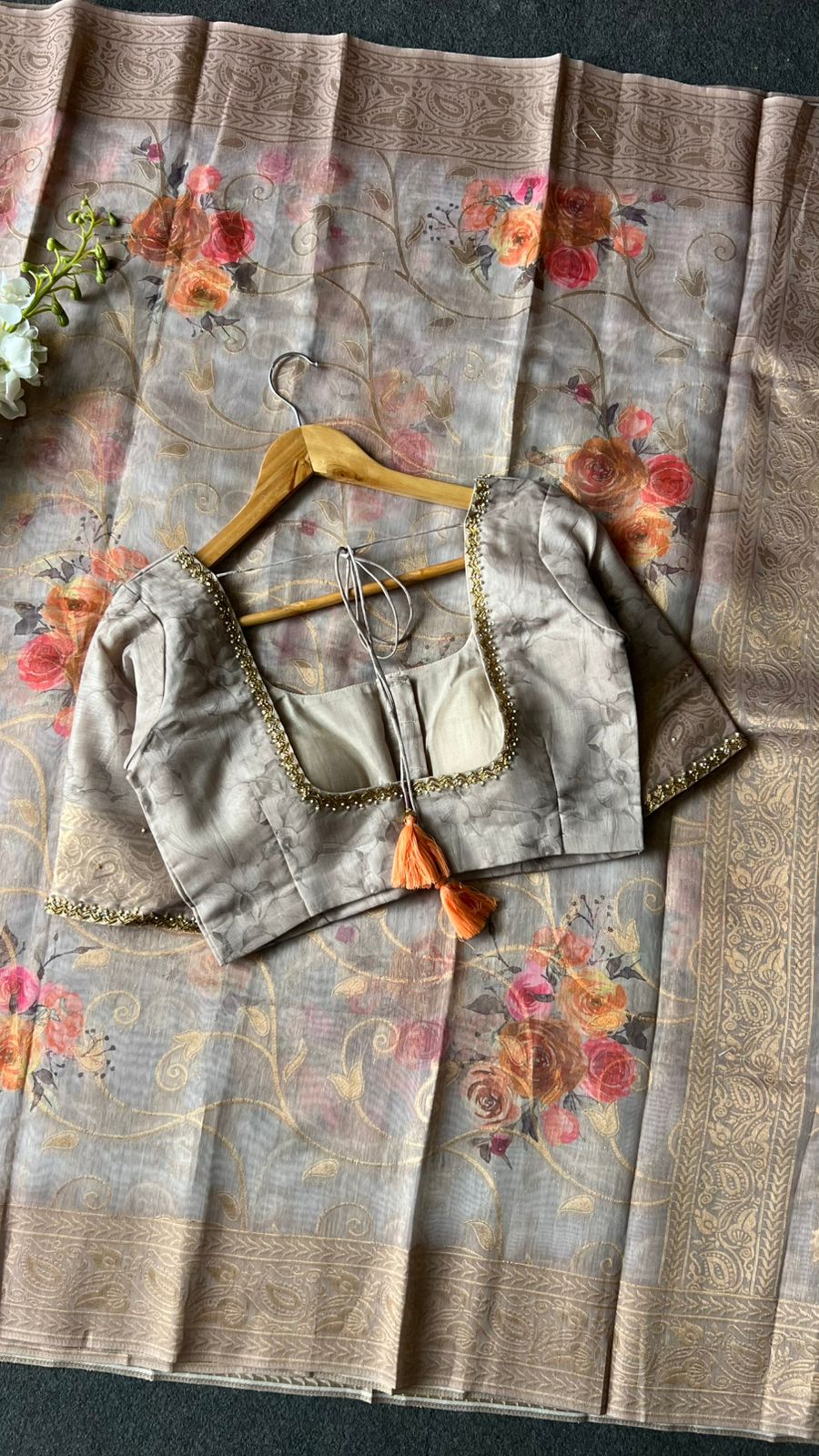 Light grey floral organza saree with hand worked blouse