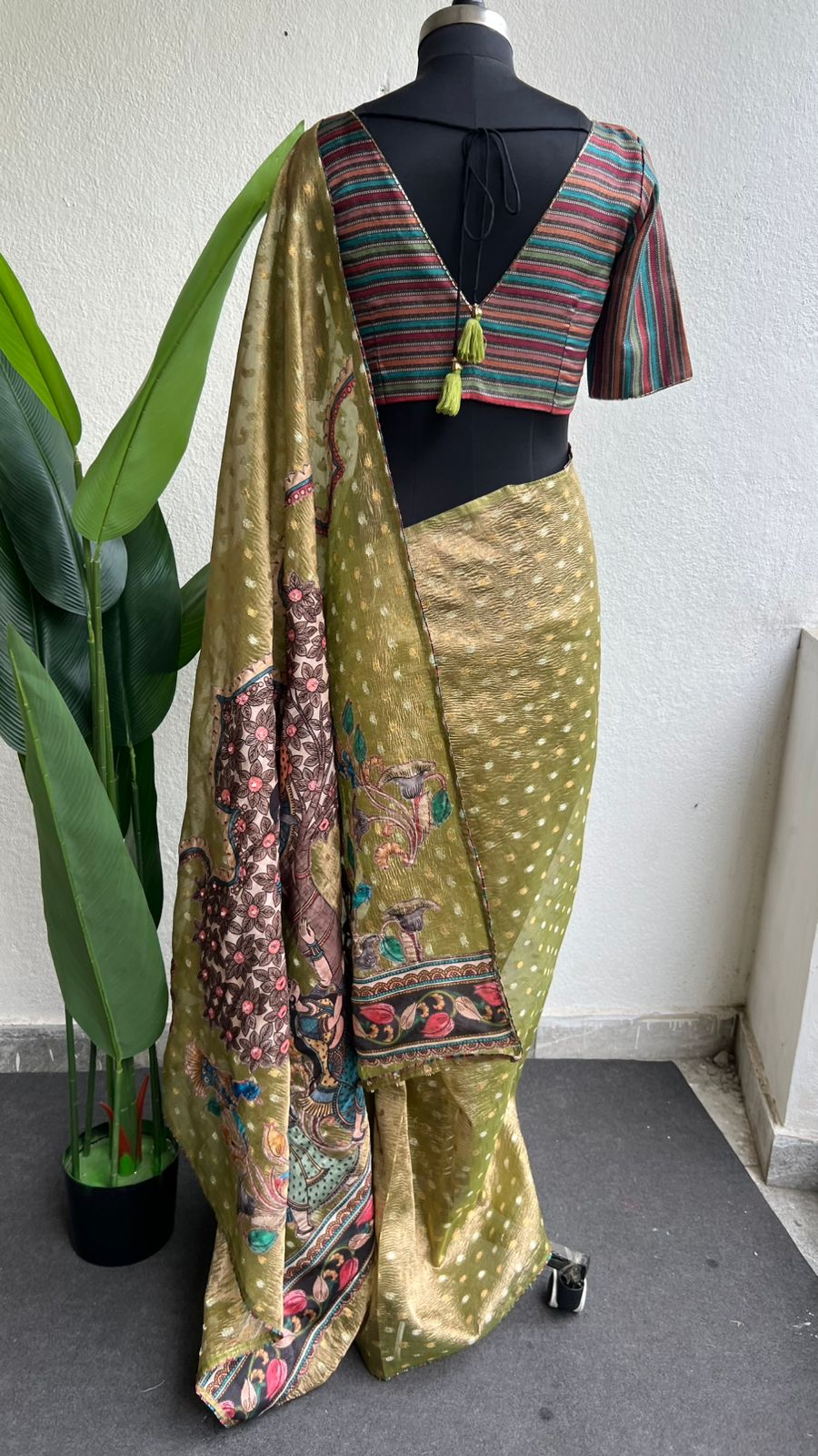 Mehandi green tissue saree with stripped hand work blouse