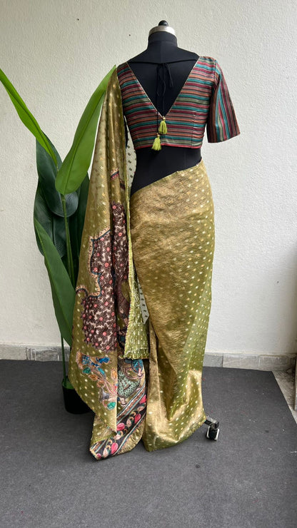 Mehandi green tissue saree with stripped hand work blouse