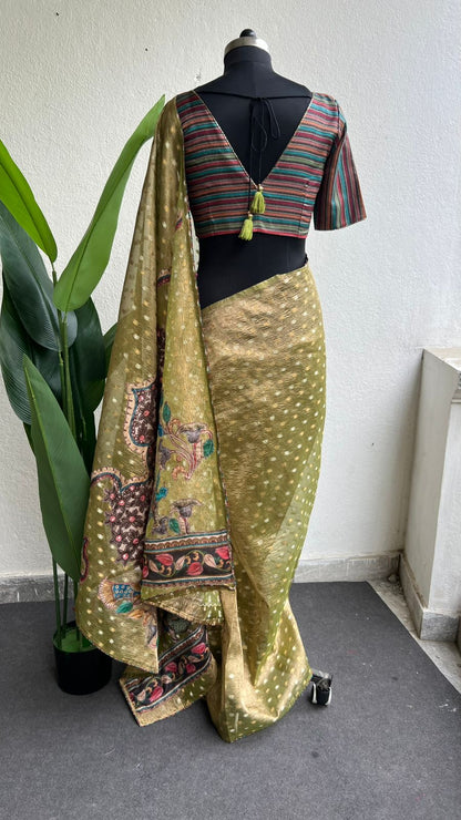 Mehandi green tissue saree with stripped hand work blouse