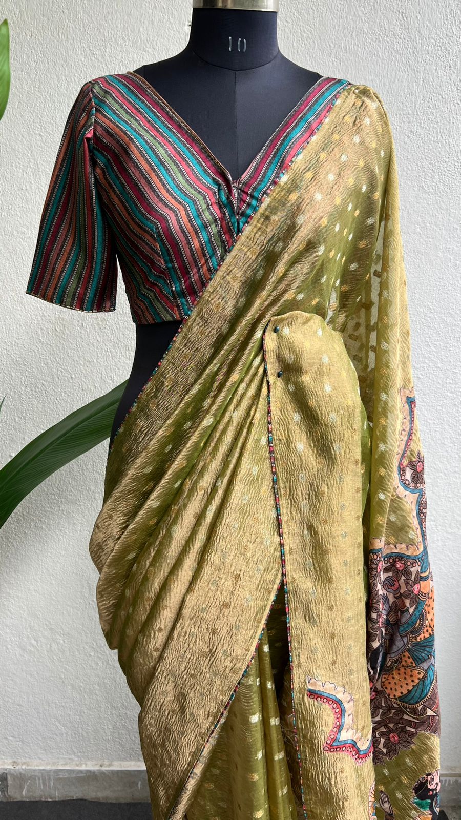 Mehandi green tissue saree with stripped hand work blouse