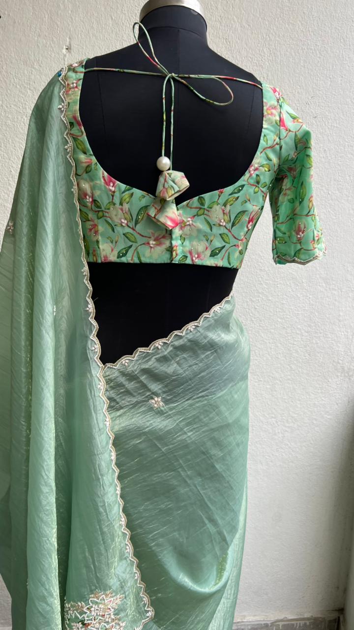 Pista green tissue saree with floral hand work blouse