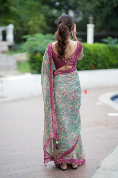 Jade green viscose jute saree with pink tissue blouse