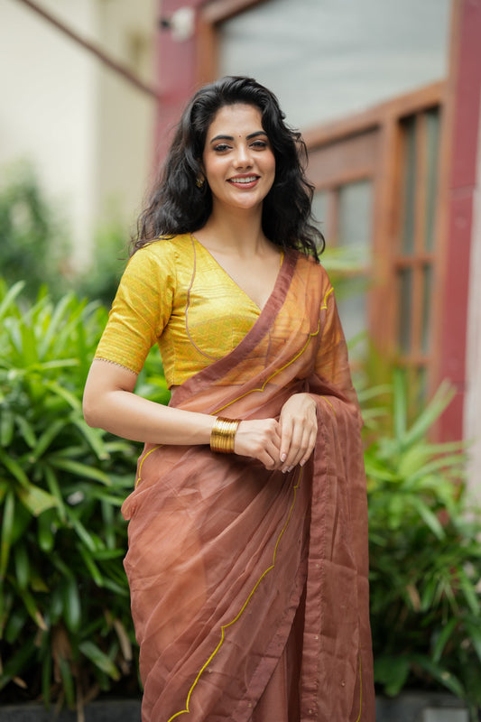 Brown soft organza saree with lime green ikkat blouse