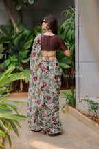 Sage green floral chiffon saree with hand work blouse