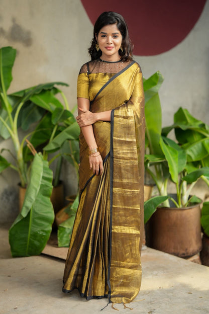 Golden soft tissue saree with hand work blouse