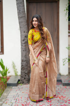 Antique gold tissue saree with parrot handwork blouse