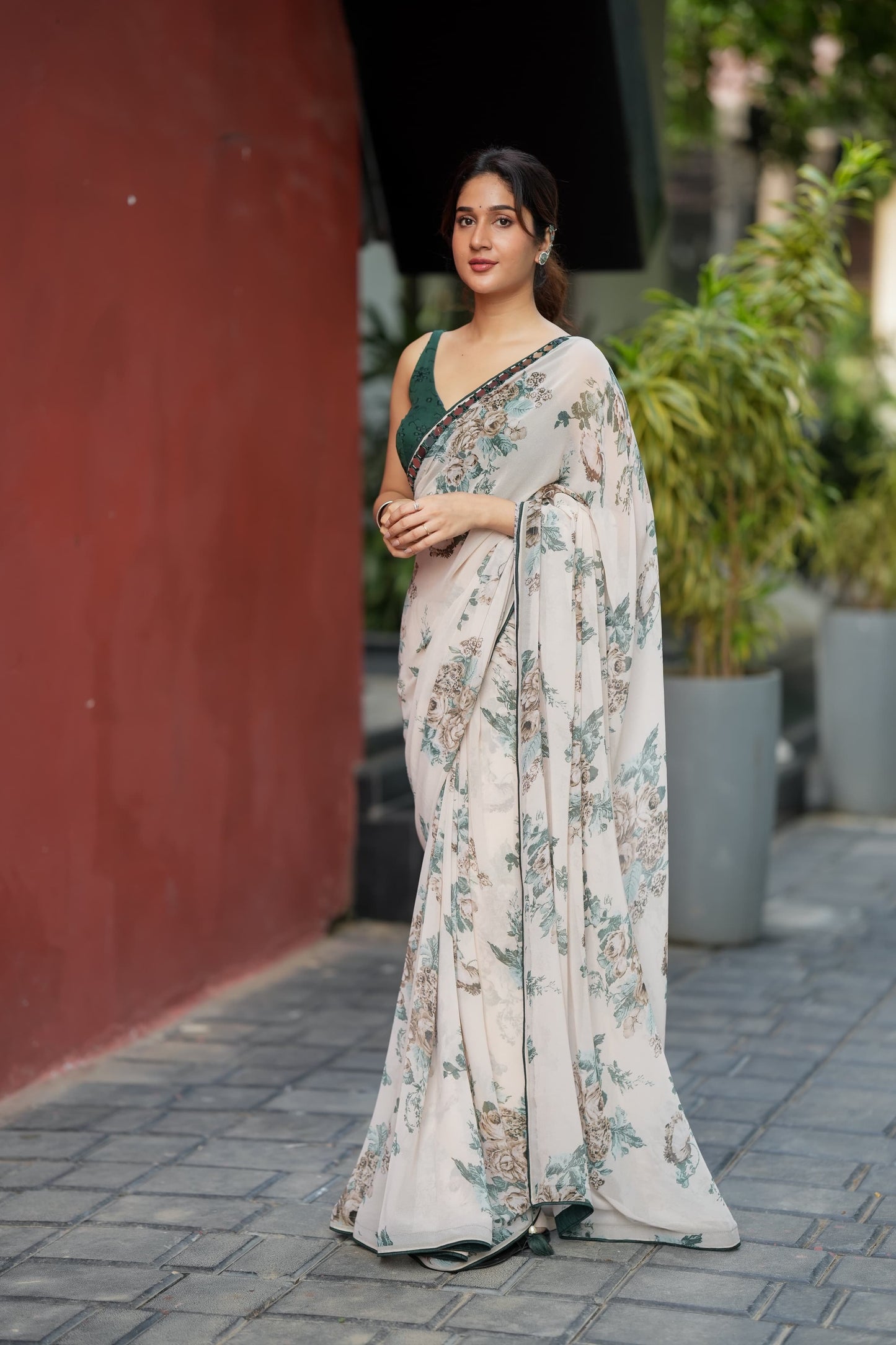 Half white chiffon floral saree with hand work blouse
