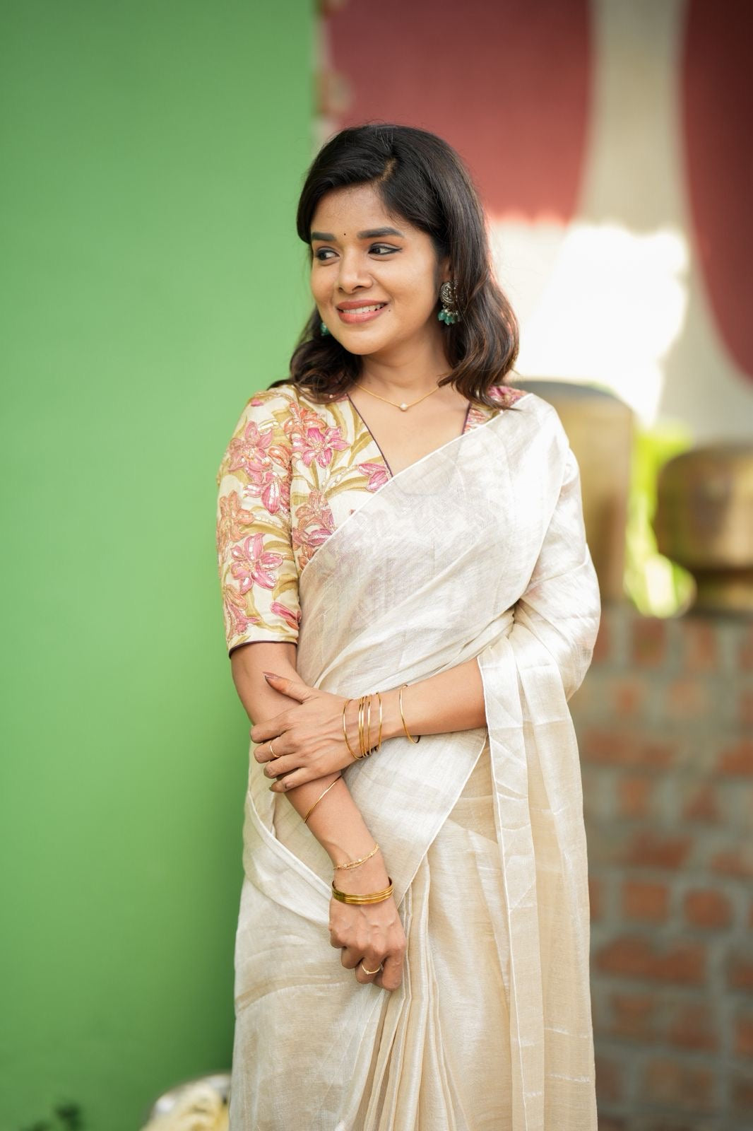 Cream soft tissue saree with embroidered blouse