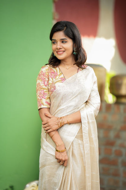 Cream soft tissue saree with embroidered blouse