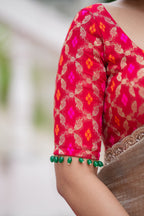 Grey tissue saree with red banarasi blouse