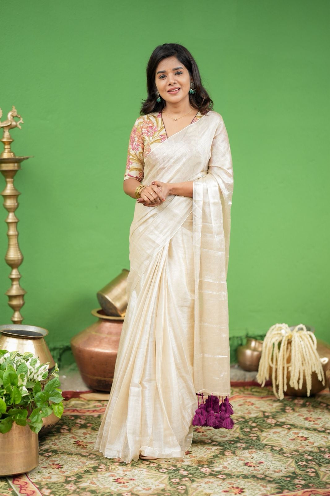 Cream soft tissue saree with embroidered blouse