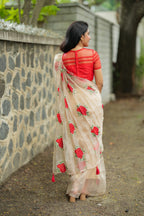 Glossy organza saree with red embroidery blouse