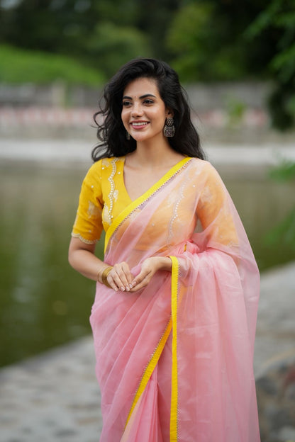 Peach organza saree with yellow hand work blouse