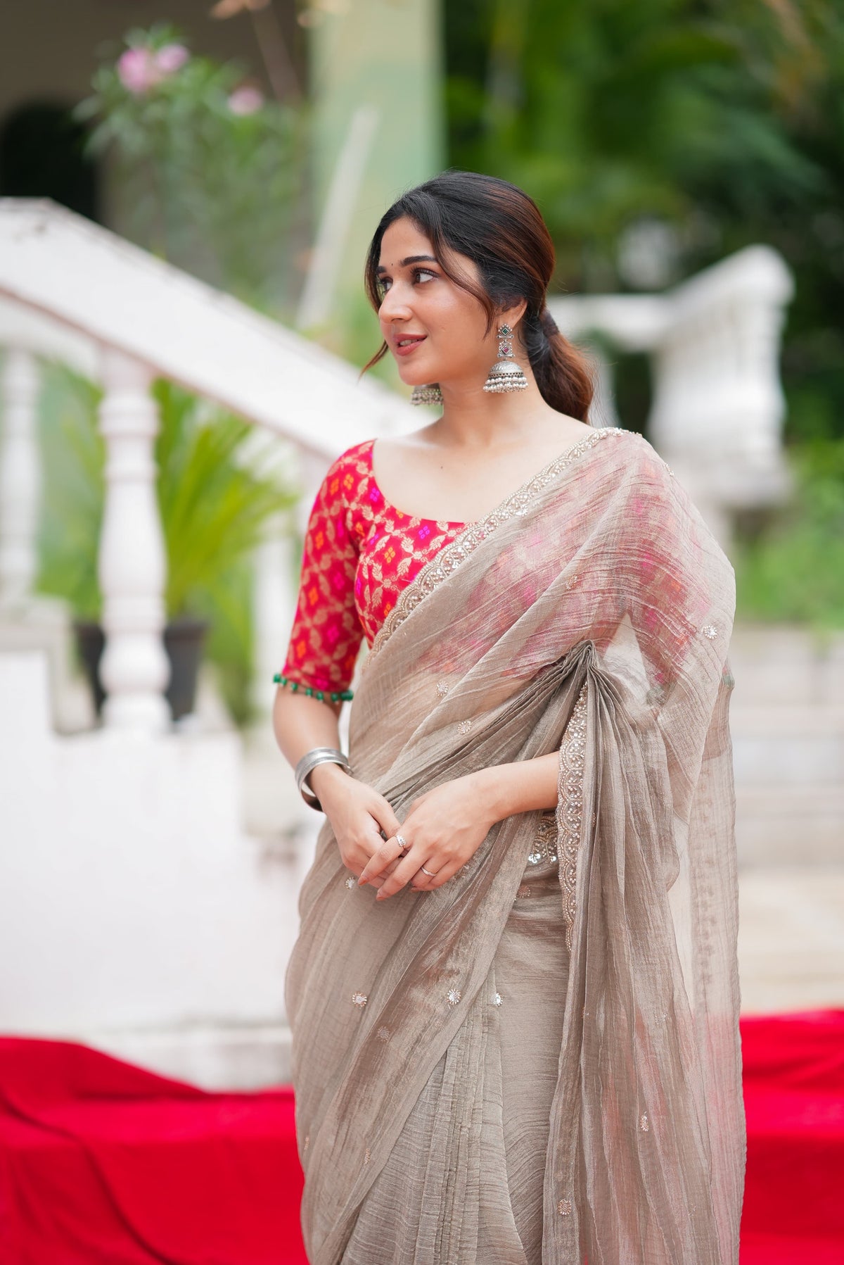 Grey tissue saree with red banarasi blouse