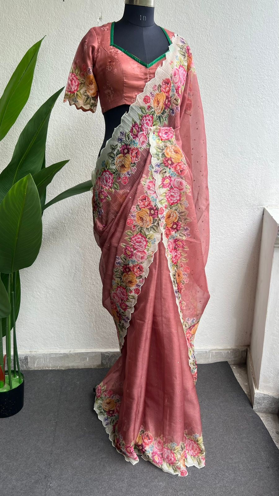 Peach floral kota doria saree with patterned blouse