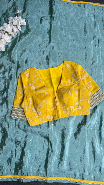 Blue glass tissue saree with yellow banarasi blouse